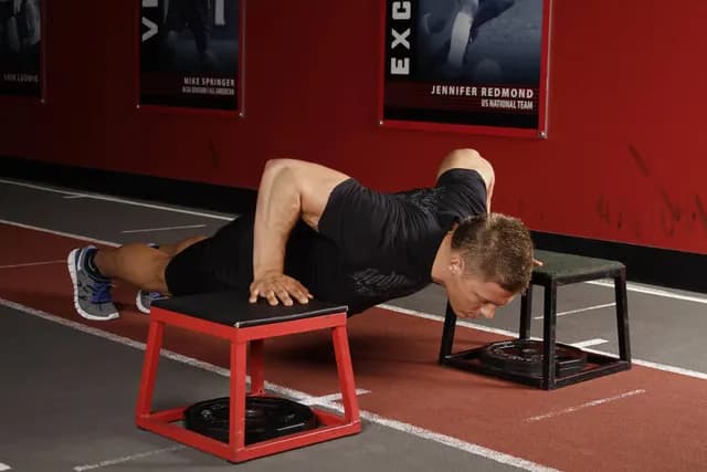 Flexão com Salto entre Caixas